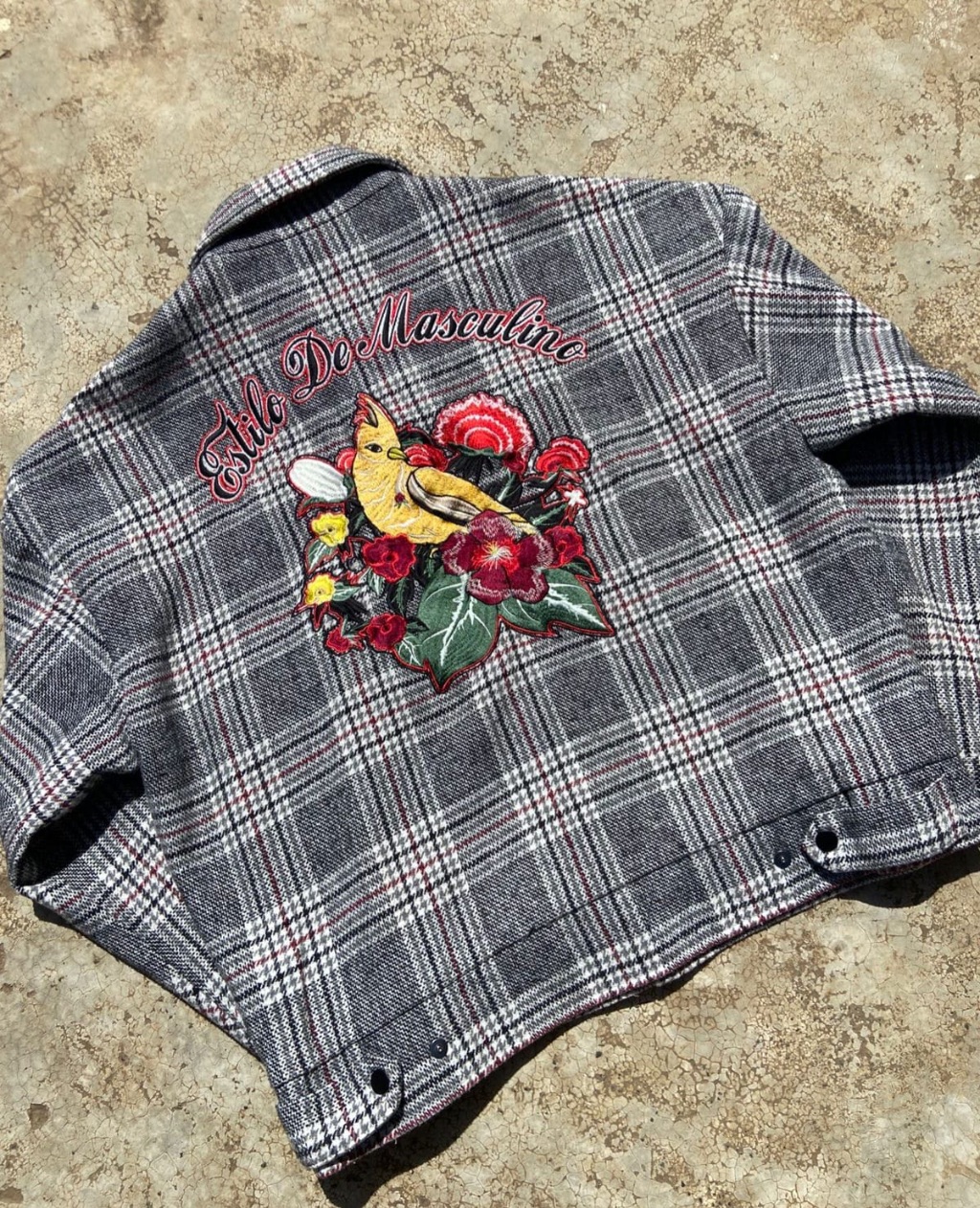 Grey plaid wool-blend work jacket with large back embroidery.